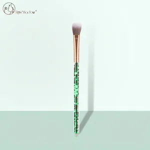 Detail of glitter makeup brush with rose gold ferrule and gradient soft bristles