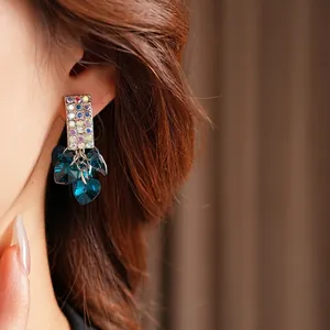 Elegant silver needle square earrings with colorful diamonds and teal heart crystal tassels