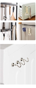 Detail view of magnetic hooks organizing kitchen tools and keys on metal surfaces