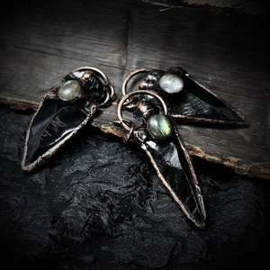 Handcrafted obsidian arrowhead pendants with labradorite inlay and bronze trim detail