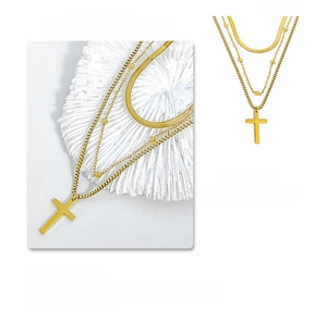 Triple-layered gold necklace set featuring flat snake chain and cross pendant detail