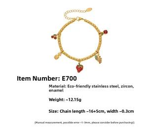 Detail view of 18k gold plated stainless steel bead bracelet with colorful fruit charms