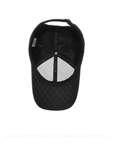 Internal view of plaid baseball cap showing reinforced seams and adjustable metal buckle