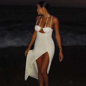 Detailed view of white backless maxi dress with halter neck and side split design