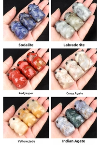 Detailed views of diverse hand-carved natural gemstone animal figurines in a grid layout