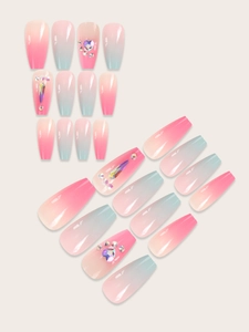 Detail of pink-blue gradient press-on nails with luxury gemstones and rhinestones