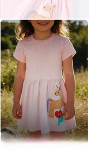 Close-up of cute cartoon horse embroidery on pink and white striped girl's dress