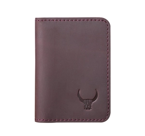 Detail of crazy horse leather card holder with hand-stitched edges and embossed highland cow logo
