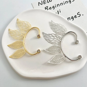 Vintage hollow leaf ear cuff set in gold and silver finish with sparkling zircons