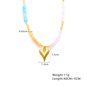 Detail shot of colorful beaded necklace with gold heart pendant and specific measurements
