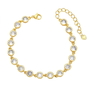 Gold tone chain bracelet with clear cubic zirconia bezel setting and heart pendant