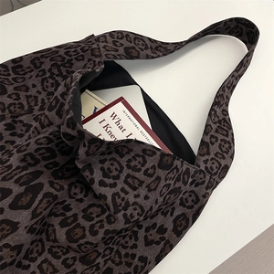Close-up of leopard print tote bag with spacious interior and durable shoulder straps