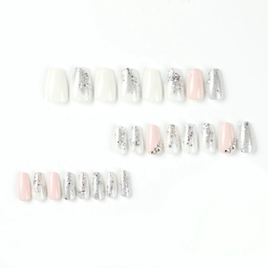 Pink and white press-on nails set with silver glitter and rhinestone decorations