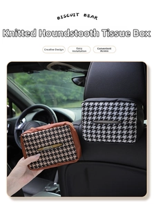 Detail view of knitted houndstooth tissue box with leather trim and elastic headrest strap
