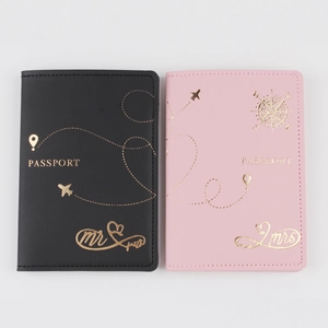Detail of Mr and Mrs gold foil stamping on black and pink PU leather passport covers