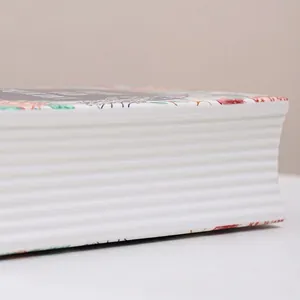 Creative white book-shaped ceramic vase with elegant floral art and ribbed texture design