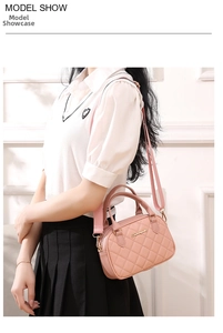 Pink quilted crossbody bag with adjustable wide strap shown on model in a stylish setting