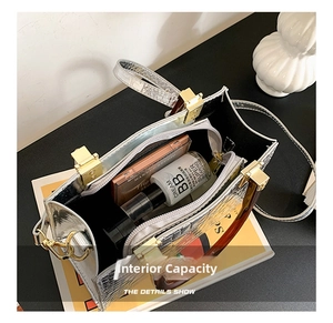 Top view of silver crocodile pattern bag interior showing zipper pocket and makeup items