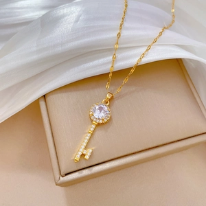 Luxurious gold titanium steel key pendant necklace with sparkling cubic zirconia crystals