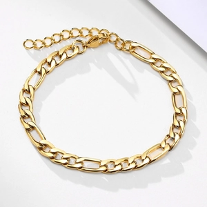 Elegant gold Figaro chain bracelet with lobster clasp and adjustable extension on white background
