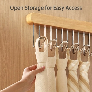 Wall-mounted wooden tie rack with metal U-hooks for organized closet accessory storage
