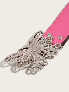 Close-up of pink leather punk belt with silver butterfly metal buckle and rivets