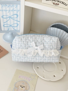 Detailed heart quilted makeup bag with blue plaid patterns and white lace bow trim