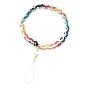 Macro view of colorful resin acrylic chain link phone strap with golden metal rings