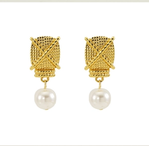 Detail of vintage 18K gold plated cable texture square studs with white pearl drops