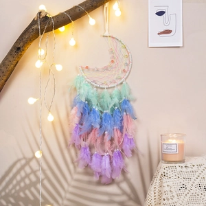 Handmade moon-shaped dream catcher with colorful feathers and decorative beads for wall decor