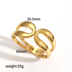 Polished 18k gold plated stainless steel wide spring cuff bangle with open design