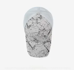 Top view of a breathable mesh trucker hat featuring a gray marble print visor and crown