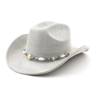 Close-up of grey suede cowboy hat with bohemian beaded band and star ornaments
