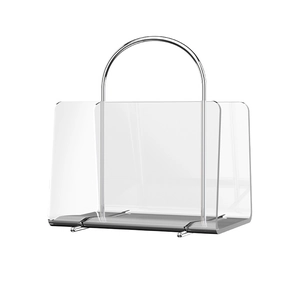 Modern transparent acrylic magazine rack with silver metal handle on white background