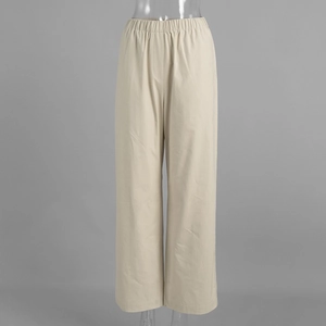 Detail of light beige wide-leg trousers showing elastic waistband and smooth drape fabric
