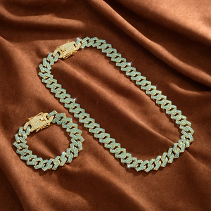 Iced out 15mm Cuban link chain and bracelet set with blue rhinestones in gold finish