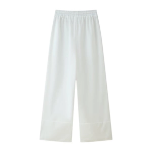Flat lay of white high-waisted wide-leg trousers with elastic waistband and smooth fabric
