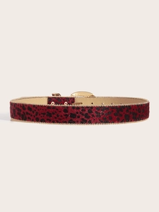 Detail showing red leopard print belt with gold beaded edges and rhinestone buckle