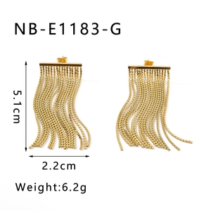 Detailed view of gold tassel earrings showing 5.1cm length and 2.2cm width dimensions