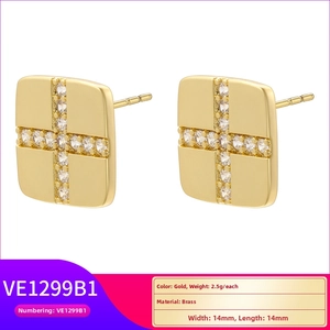 Close-up of gold-plated square cross stud earrings with clear zircon stones on a white base