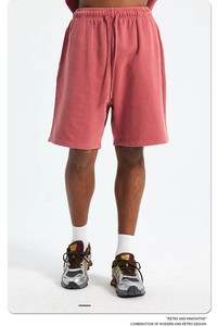 Detail of red vintage washed heavy cotton knit shorts with elastic drawstring waist