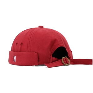 Red docker hat with N embroidery and adjustable metal buckle on white background