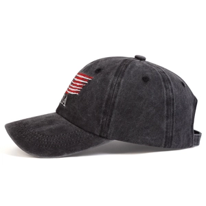 Detail of USA flag embroidery on washed distressed grey cotton baseball cap with curved brim