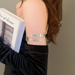 Detail of silver leaf laurel arm cuff bracelet showing double layer wrap design
