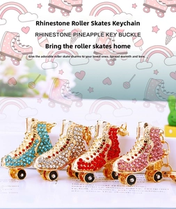 Detail of four colorful rhinestone roller skate keychains with lobster clasps and rings