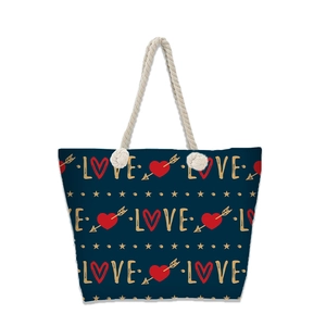 Detail of navy blue beach tote with LOVE print, heart pattern, and knotted rope handles