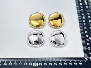 Detail of 35mm round hammered metal earrings with sparkling rhinestone trim in gold and silver
