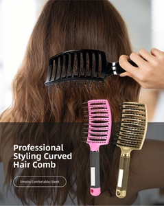 Close-up of curved vented hair brush with boar bristles and anti-slip diamond handle