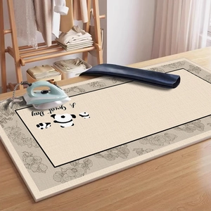 Heat resistant ironing mat with panda print for tabletop use on a wooden desk