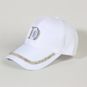 Detail of white denim baseball cap featuring rhinestone D logo and motorsport lifestyle text